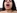 une brune baise sur un lit